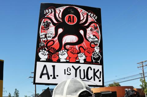 Ethical concerns – like the mistreatment of content creators decried by this protester – drive both veganism and resistance to using AI. Mario Tama/Getty Images