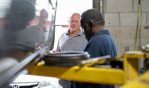 Ray Butler and an employee at Butler's Tire & Lube in Pembroke